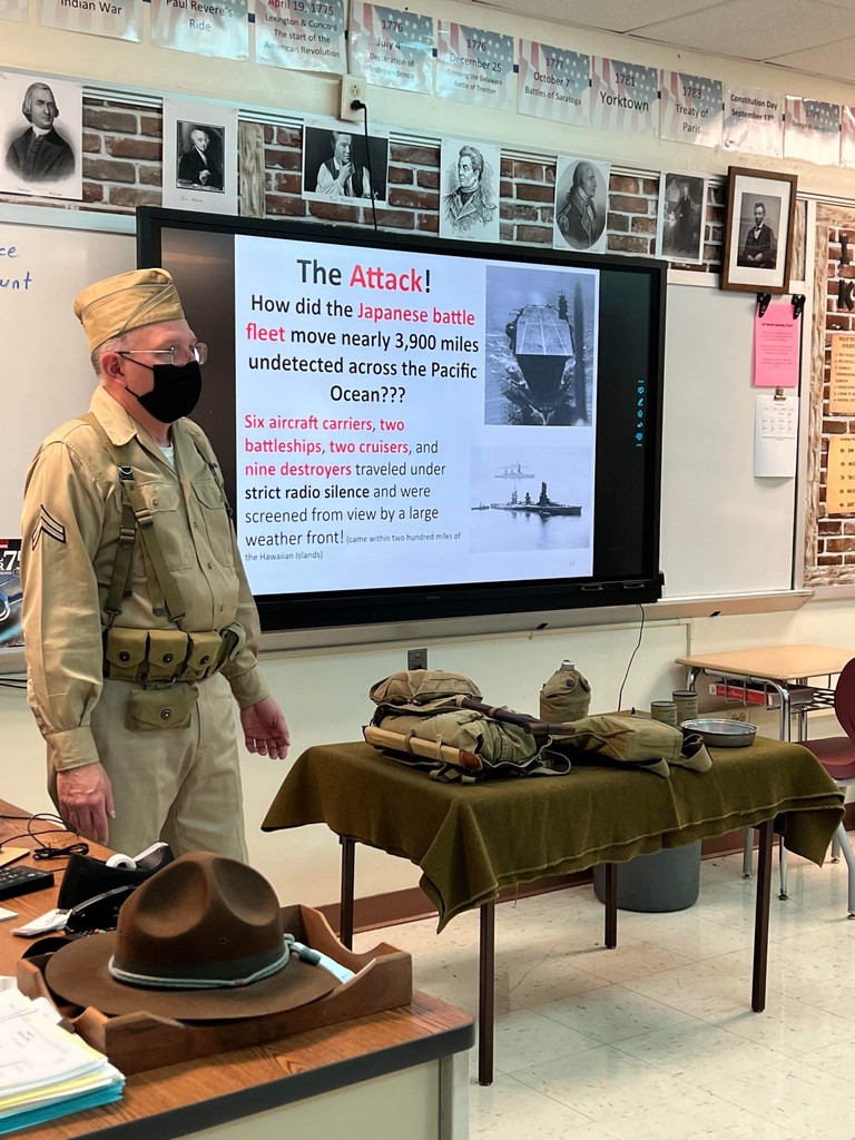 Mr. Paterline dressed in WWII uniform talks about the attacks on Pearl Harbor.