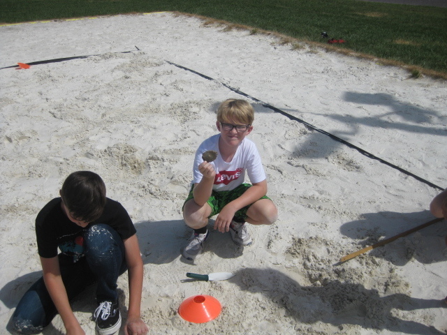 6th grade students participate in an archaeological dig