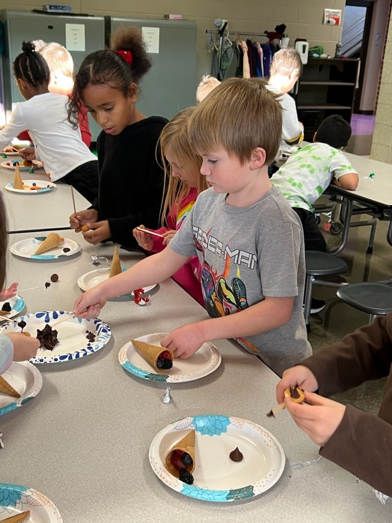 Mrs. Hill's 2nd graders making and enjoying cornucopias.