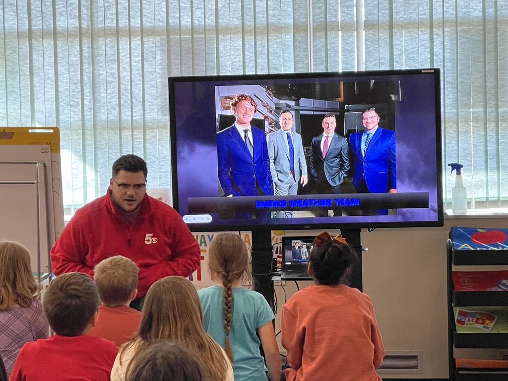 Meteorologist Stephen Elmore explains broadcast weather to the students