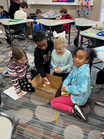 Mrs. Hill's 2nd graders building their coolers.