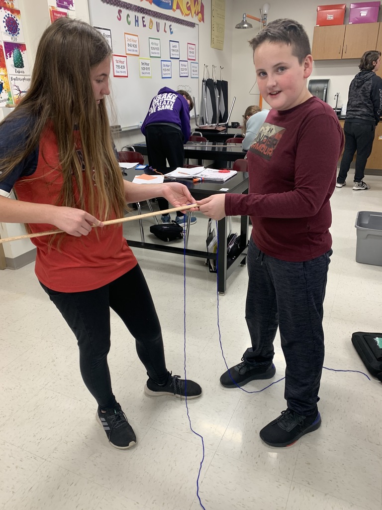 Science class students measuring