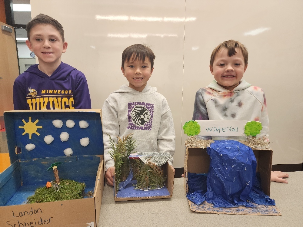 Second graders presenting landform projects.