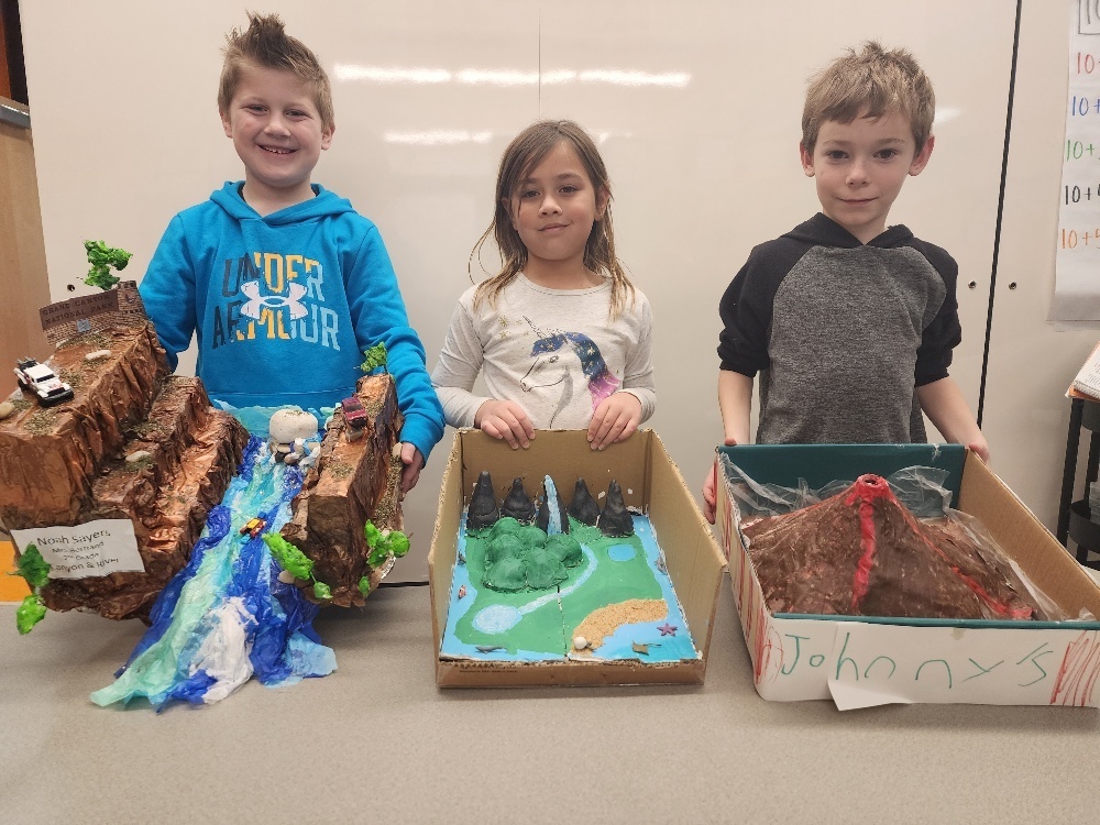 Second graders presenting landform projects.